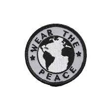 Wear The Peace logo